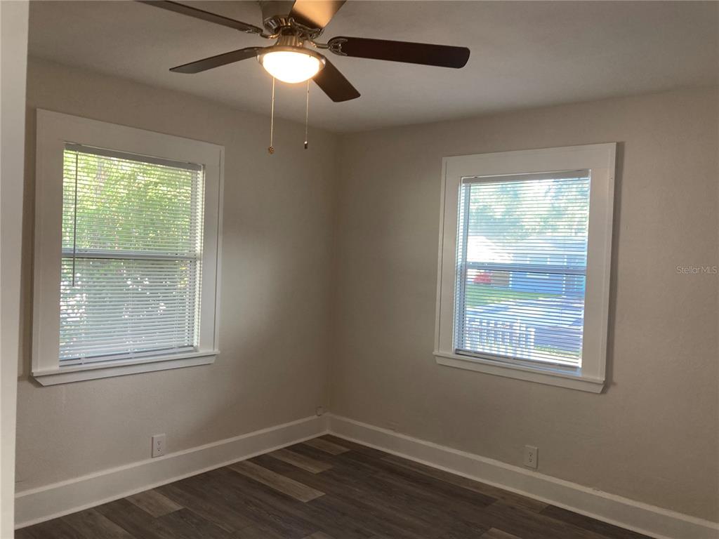 5200 3rd Avenue South St. Petersburg, FL 33707 - Photo 41 of 47 a view of an empty room with wooden floor and a window