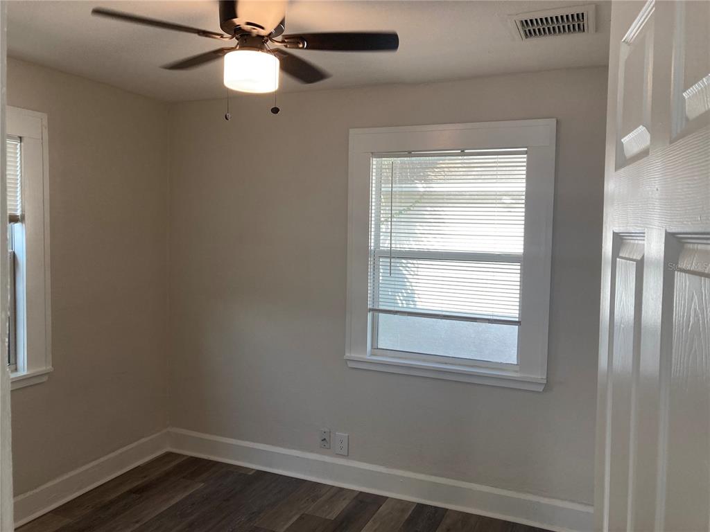 5200 3rd Avenue South St. Petersburg, FL 33707 - Photo 44 of 47 a view of an empty room with wooden floor and a window