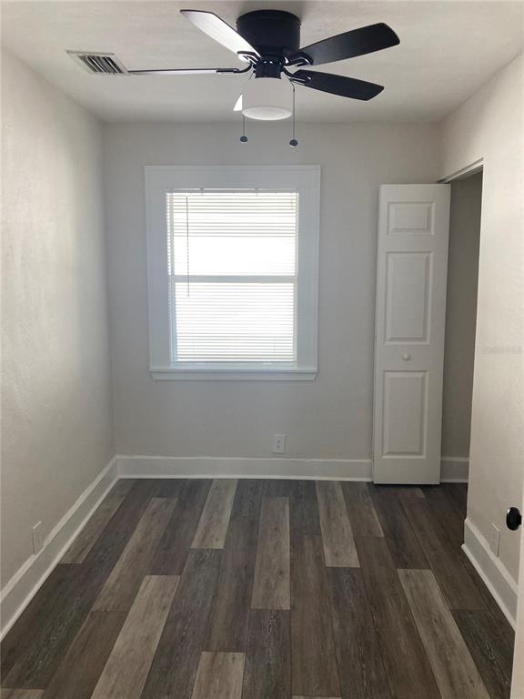 5200 3rd Avenue South St. Petersburg, FL 33707 - Photo 47 of 47 wooden floor in an empty room with a window
