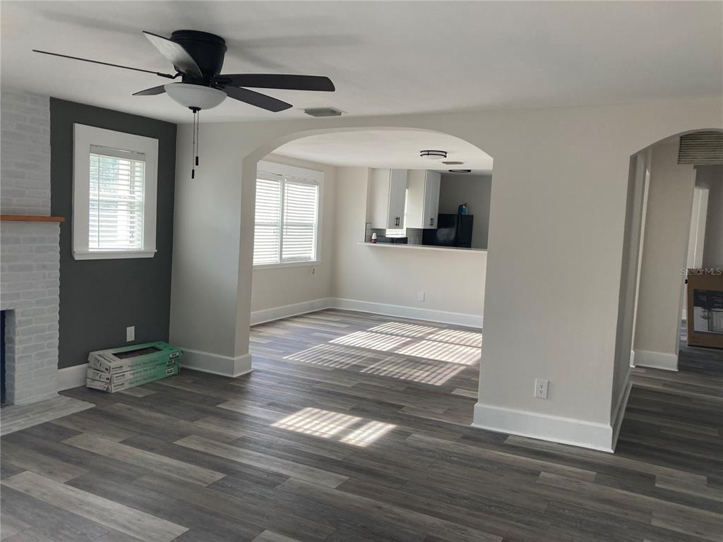 5200 3rd Avenue South St. Petersburg, FL 33707 - Photo 8 of 47 a view of empty room with wooden floor and fan