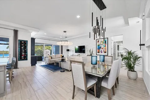 a kitchen with stainless steel appliances a sink a stove and cabinets