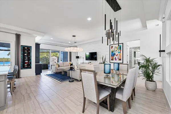 a kitchen with stainless steel appliances a sink a stove and cabinets