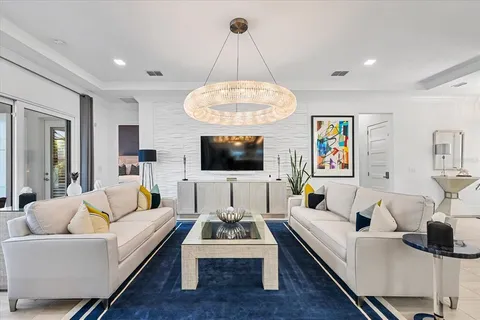 a kitchen with white cabinets and appliances