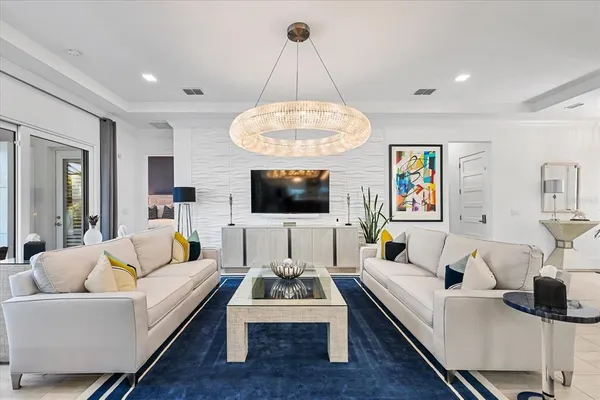 a kitchen with white cabinets and appliances