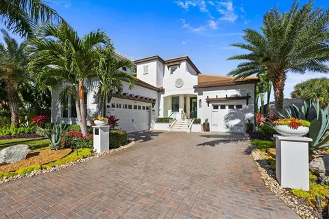 a view of a house with swimming pool and sitting area