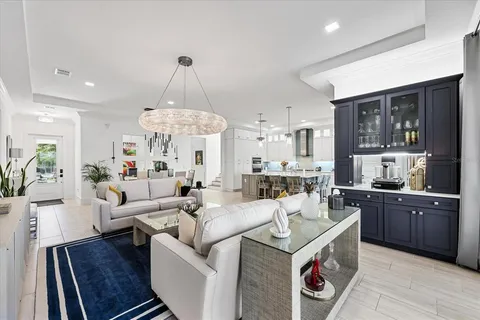 a bedroom with a bed and large windows