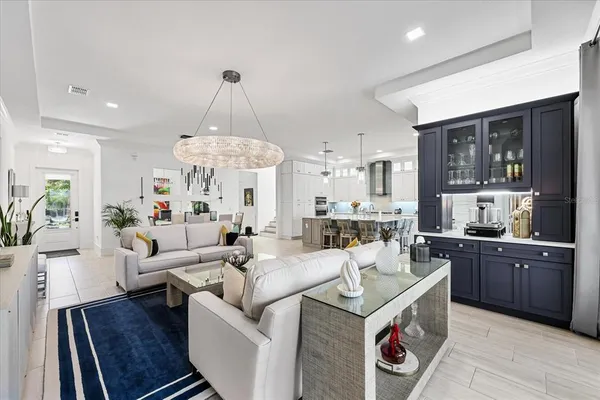 a bedroom with a bed and large windows