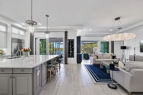 a bedroom with a large bed couch and a window