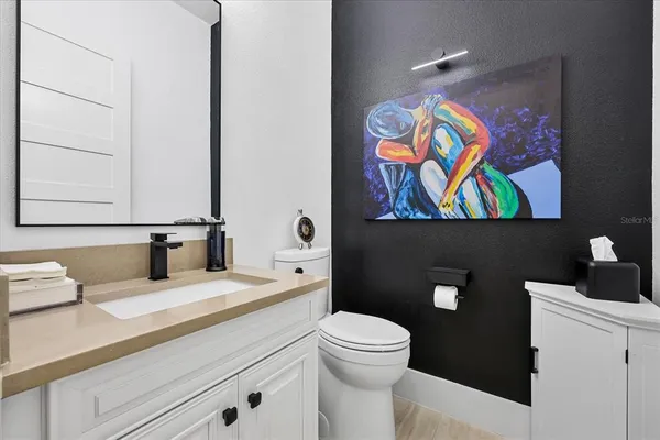 a bedroom with bed and a flat screen tv