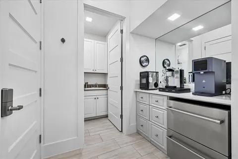 a view of walk in closet with clothes