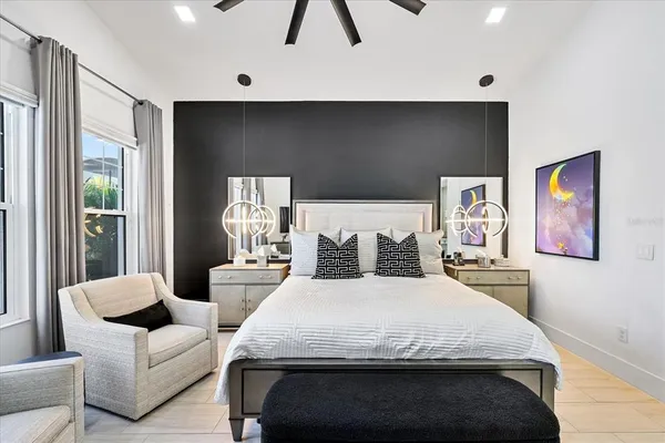 a balcony with furniture and a floor to ceiling window