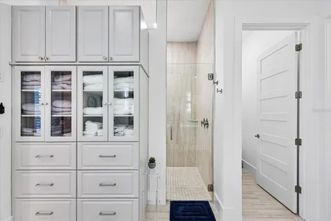 a bathroom with a double vanity sink and a mirror