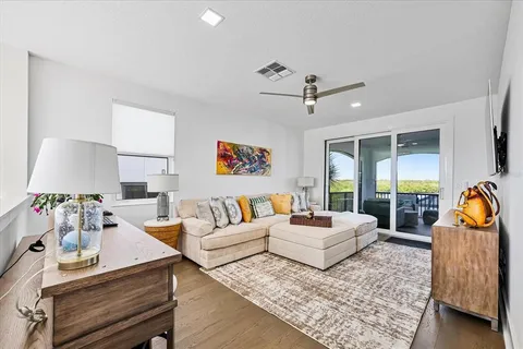 a work room with furniture and a flat screen tv