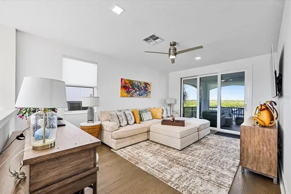 a work room with furniture and a flat screen tv