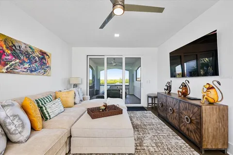 a view of swimming pool with sitting area
