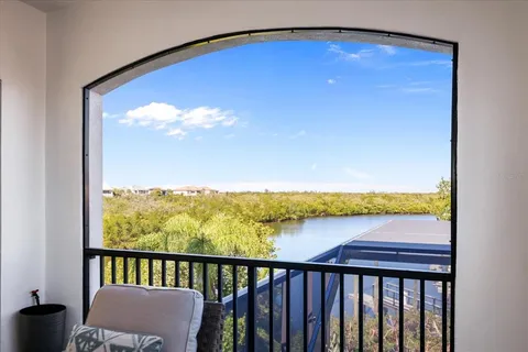 a view of a patio with a table and chairs