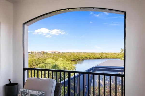 a view of a patio with a table and chairs