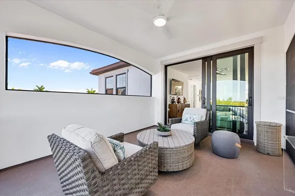 a view of a patio with a table chairs and a potted plant
