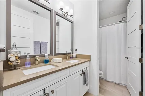 an aerial view of residential houses with outdoor space and river view