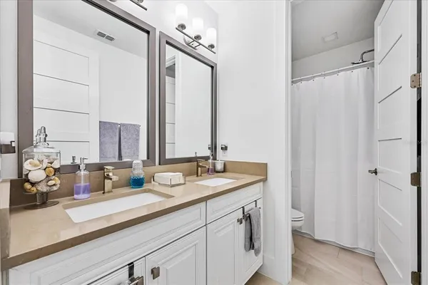 an aerial view of residential houses with outdoor space and river view