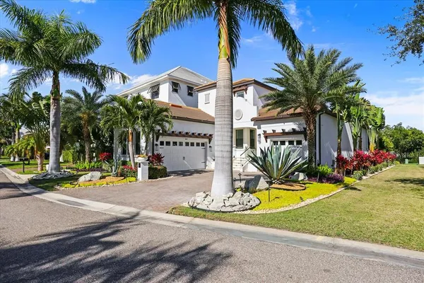 a front view of a house with outdoor seating