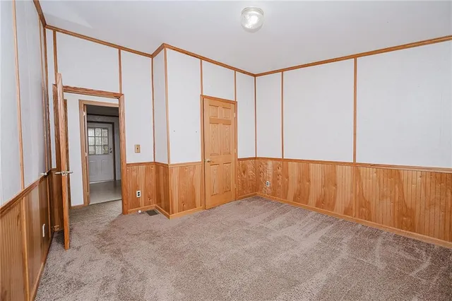 an empty room with closet area