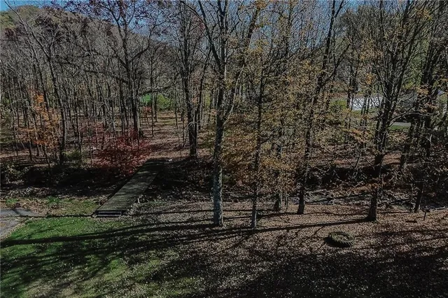 an aerial view of a house with outdoor space