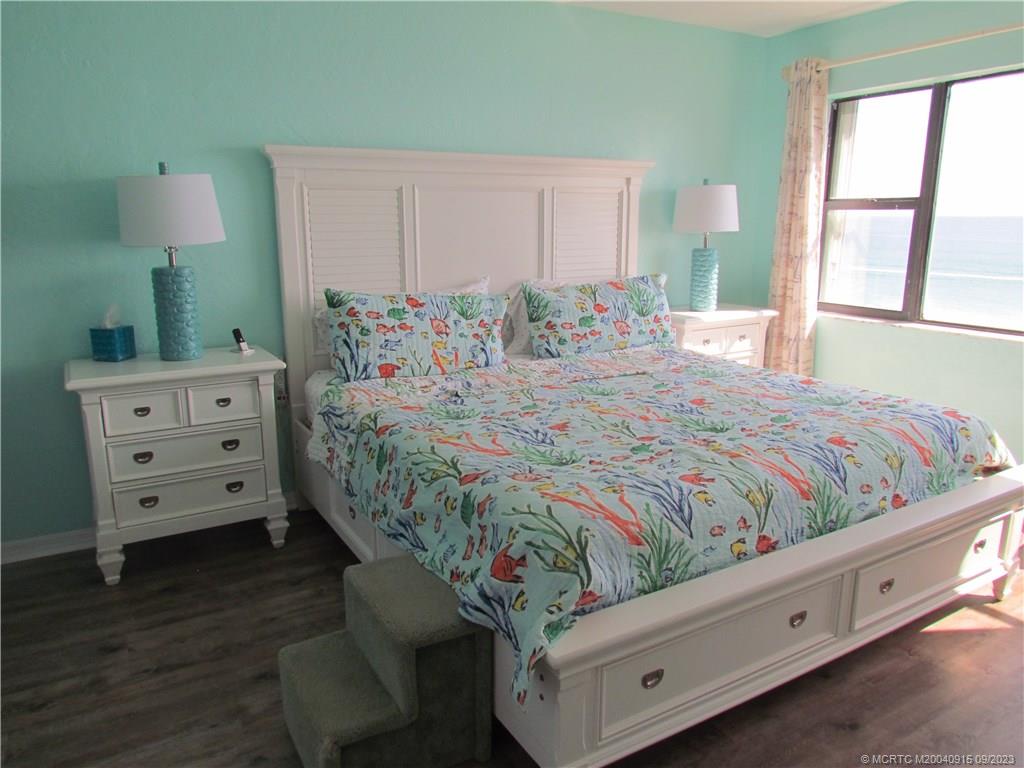 9400 South Ocean Drive, Unit 504B Jensen Beach, FL 34957 - Photo 20 of 42 a bedroom with a bed and a window