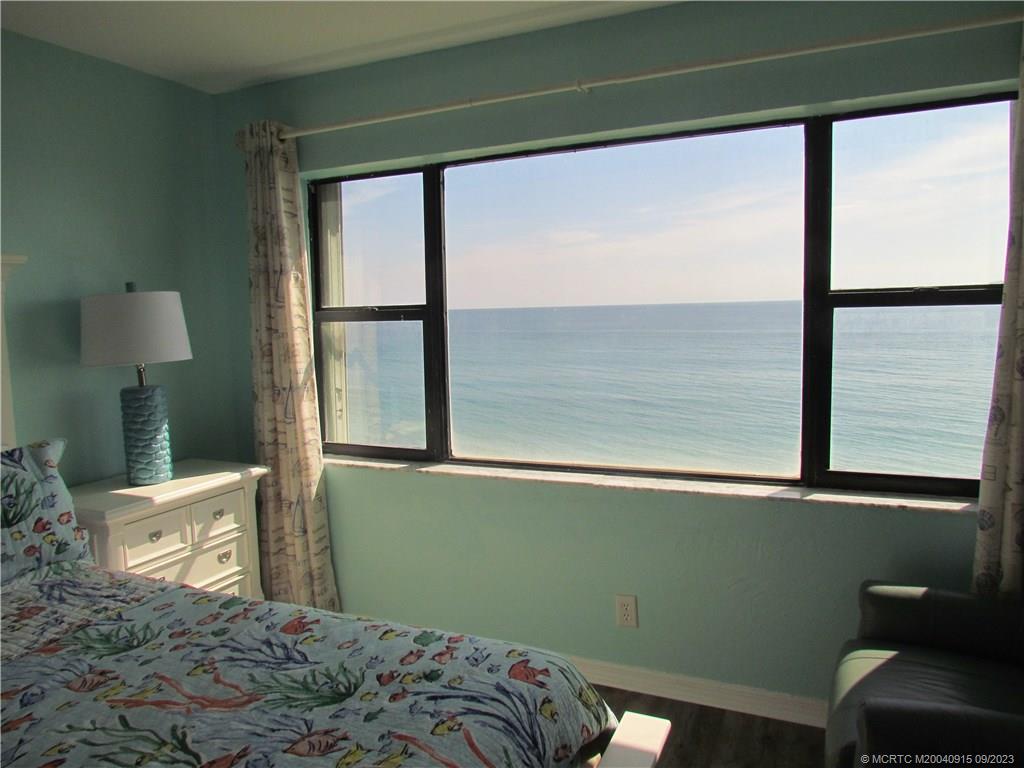 9400 South Ocean Drive, Unit 504B Jensen Beach, FL 34957 - Photo 23 of 42 a bedroom with a bed and a window