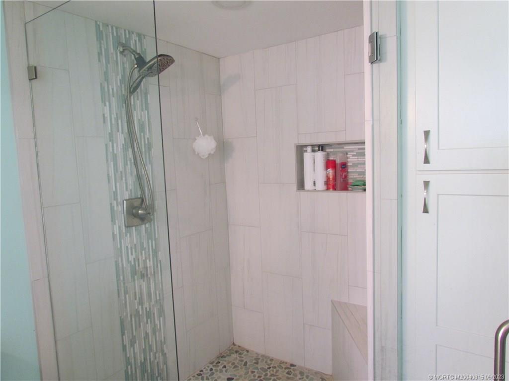 9400 South Ocean Drive, Unit 504B Jensen Beach, FL 34957 - Photo 26 of 42 a bathroom with a shower and a sink