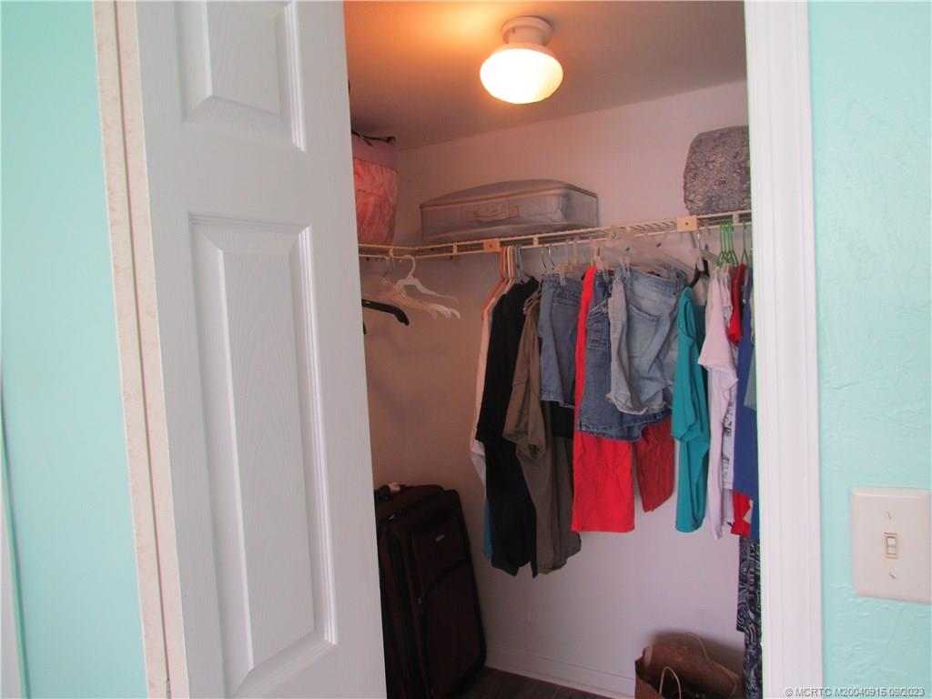 9400 South Ocean Drive, Unit 504B Jensen Beach, FL 34957 - Photo 28 of 42 a view of walk in closet with clothes