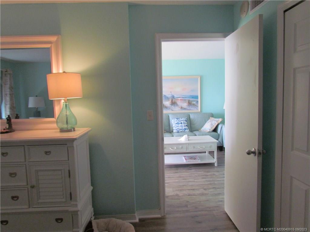 9400 South Ocean Drive, Unit 504B Jensen Beach, FL 34957 - Photo 29 of 42 a bathroom with a sink a toilet and a mirror