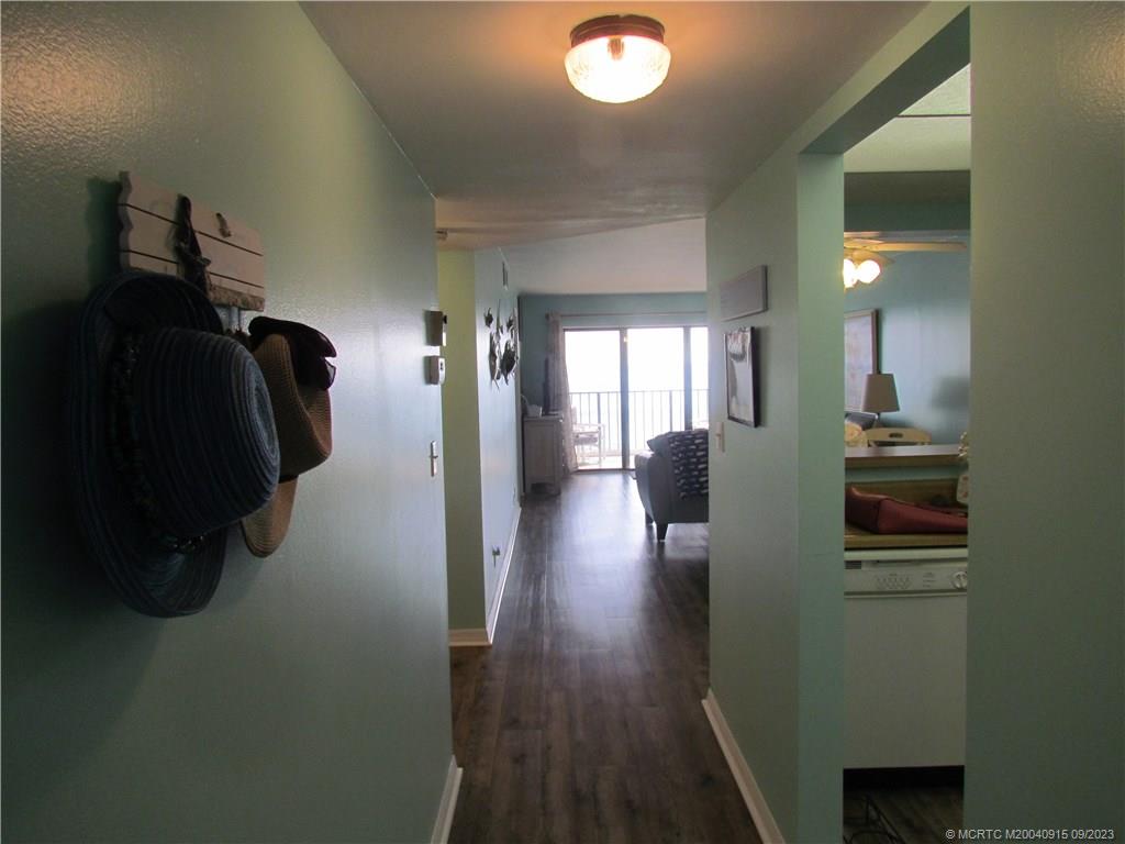9400 South Ocean Drive, Unit 504B Jensen Beach, FL 34957 - Photo 3 of 42 a view of hallway with wooden floor