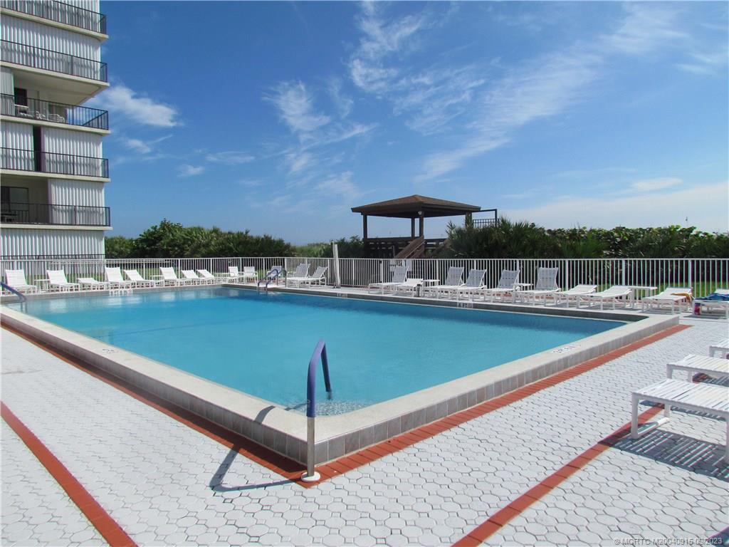 9400 South Ocean Drive, Unit 504B Jensen Beach, FL 34957 - Photo 39 of 42 a view of a swimming pool with a deck