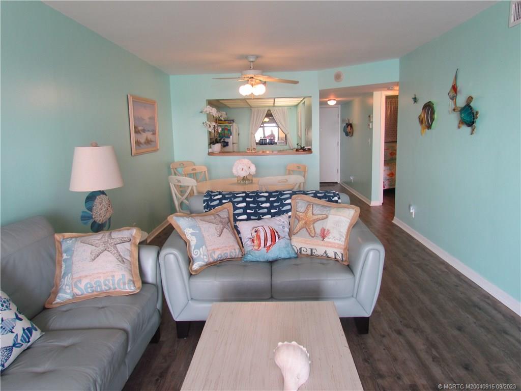 9400 South Ocean Drive, Unit 504B Jensen Beach, FL 34957 - Photo 7 of 42 a living room with furniture and a lamp