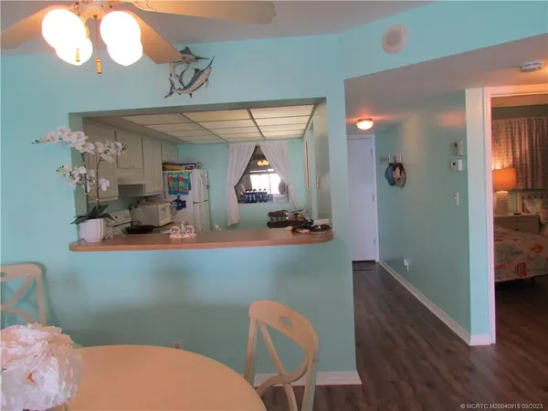 a bathroom with a sink mirror and toilet