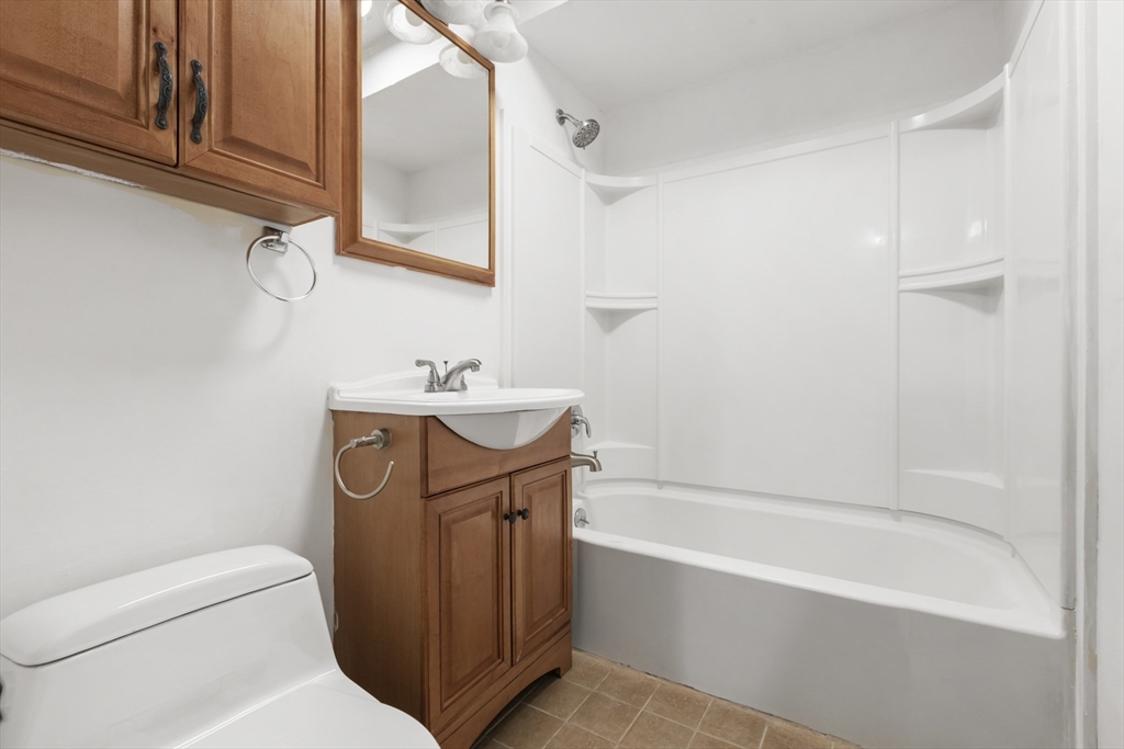570 Sutton Street Northbridge, MA 01534 - Photo 12 of 20 a bathroom with a sink a toilet and bathtub