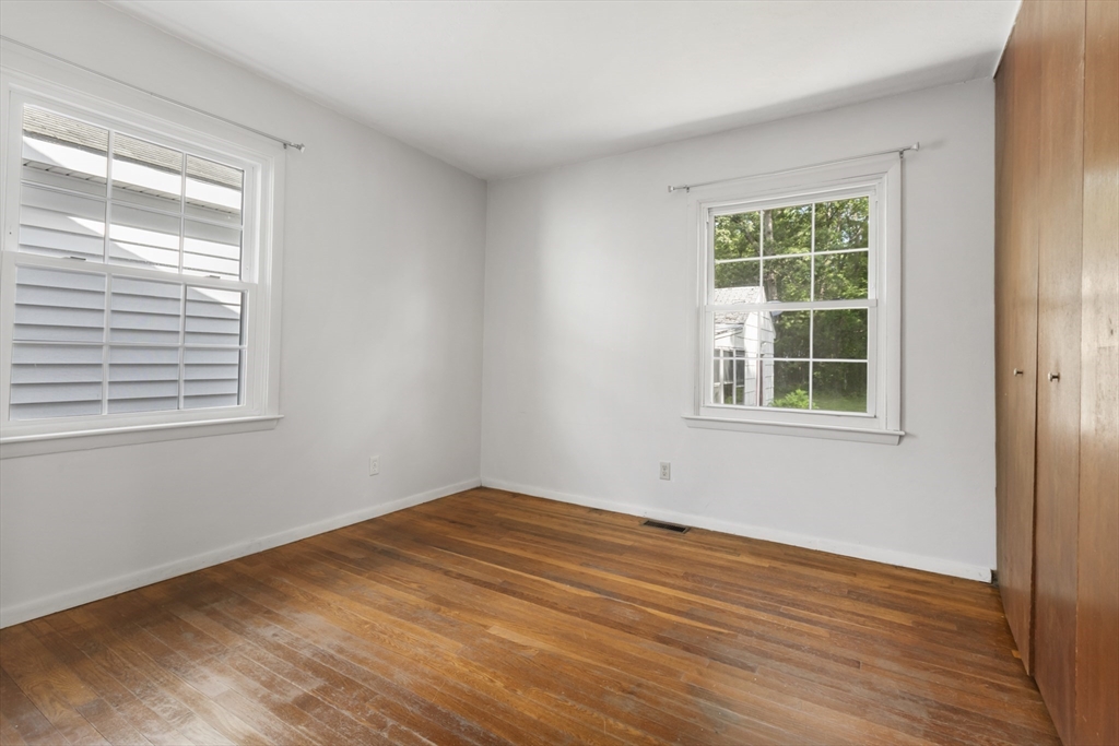 570 Sutton Street Northbridge, MA 01534 - Photo 9 of 20 a view of empty room with wooden floor and fan