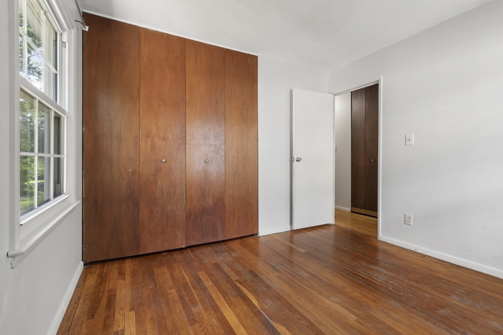 570 Sutton Street Northbridge, MA 01534 - Photo 10 of 20 an empty room with wooden floor and windows
