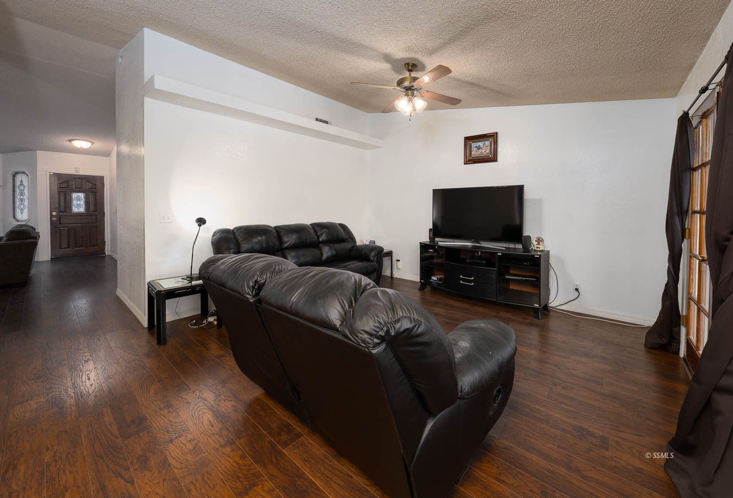 800 Valarie Street Ridgecrest, CA 93555 - Photo 12 of 39 a living room with furniture and a flat screen tv
