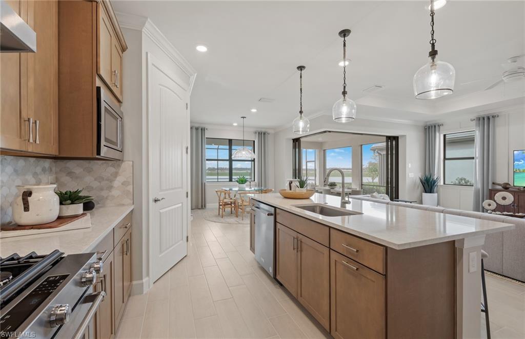 18420 Ridgeline Drive Estero, FL 33928 - Photo 33 of 48 Kitchen Island - Photos are from a model home and are for illustration purposes only.