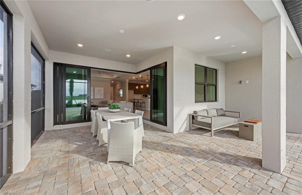 18420 Ridgeline Drive Estero, FL 33928 - Photo 40 of 48 Zero corner sliders onto covered lanai