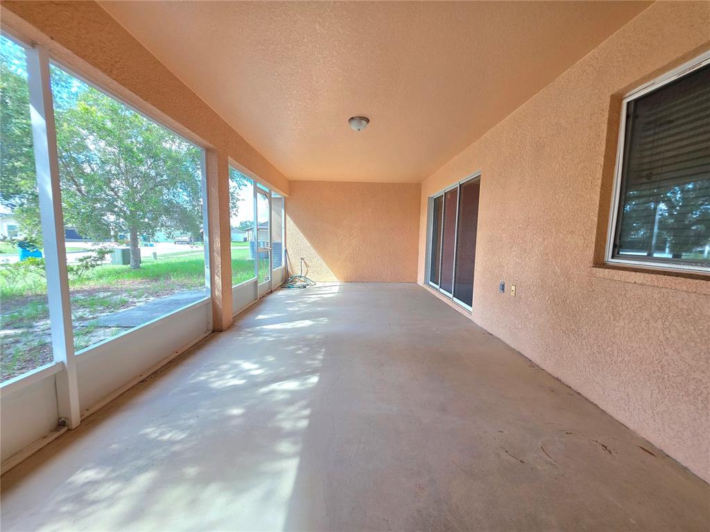 4284 High Ridge Avenue Spring Hill, FL 34609 - Photo 36 of 40 a view of a big room with windows