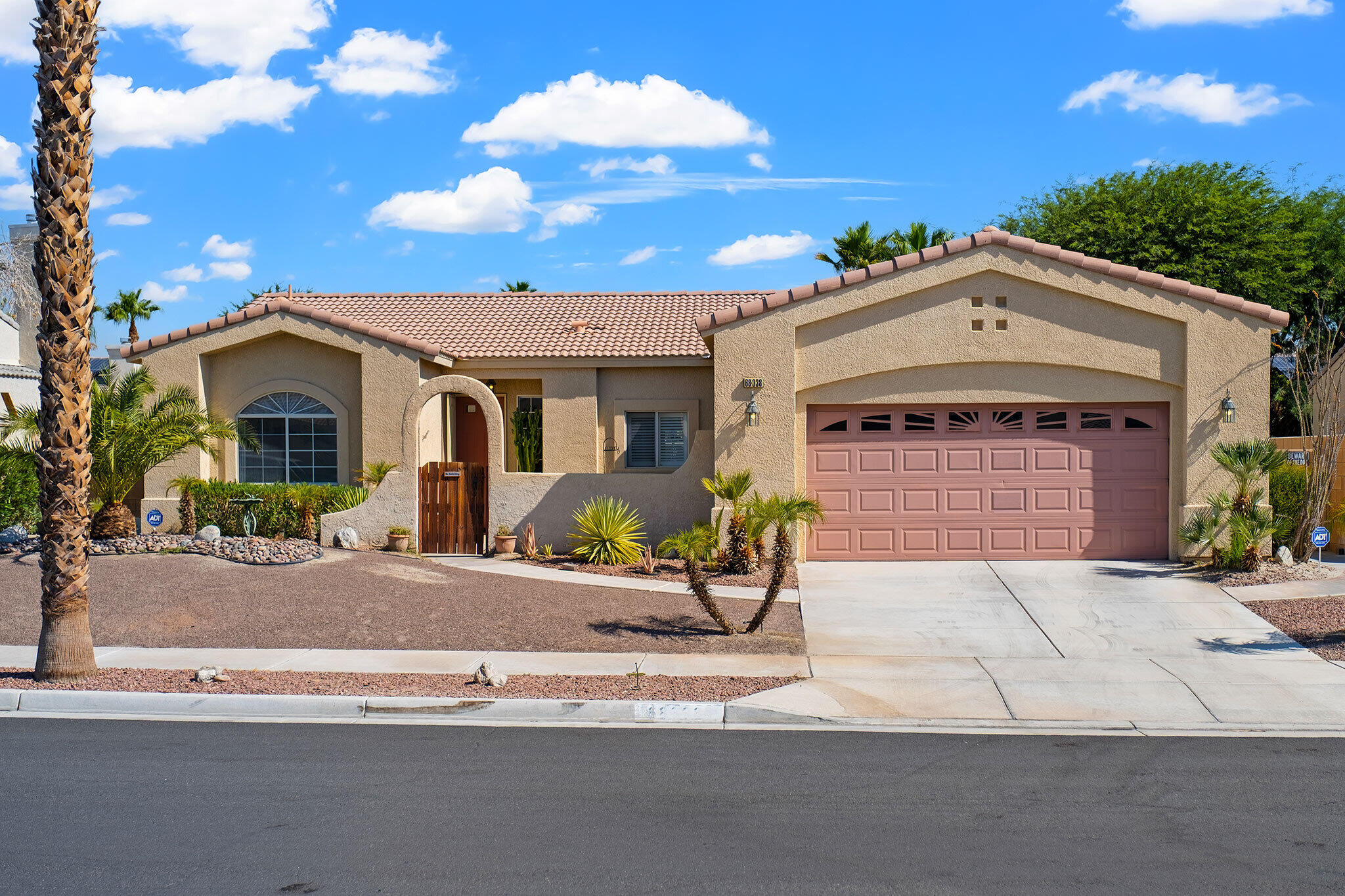 a front view of a house with garage