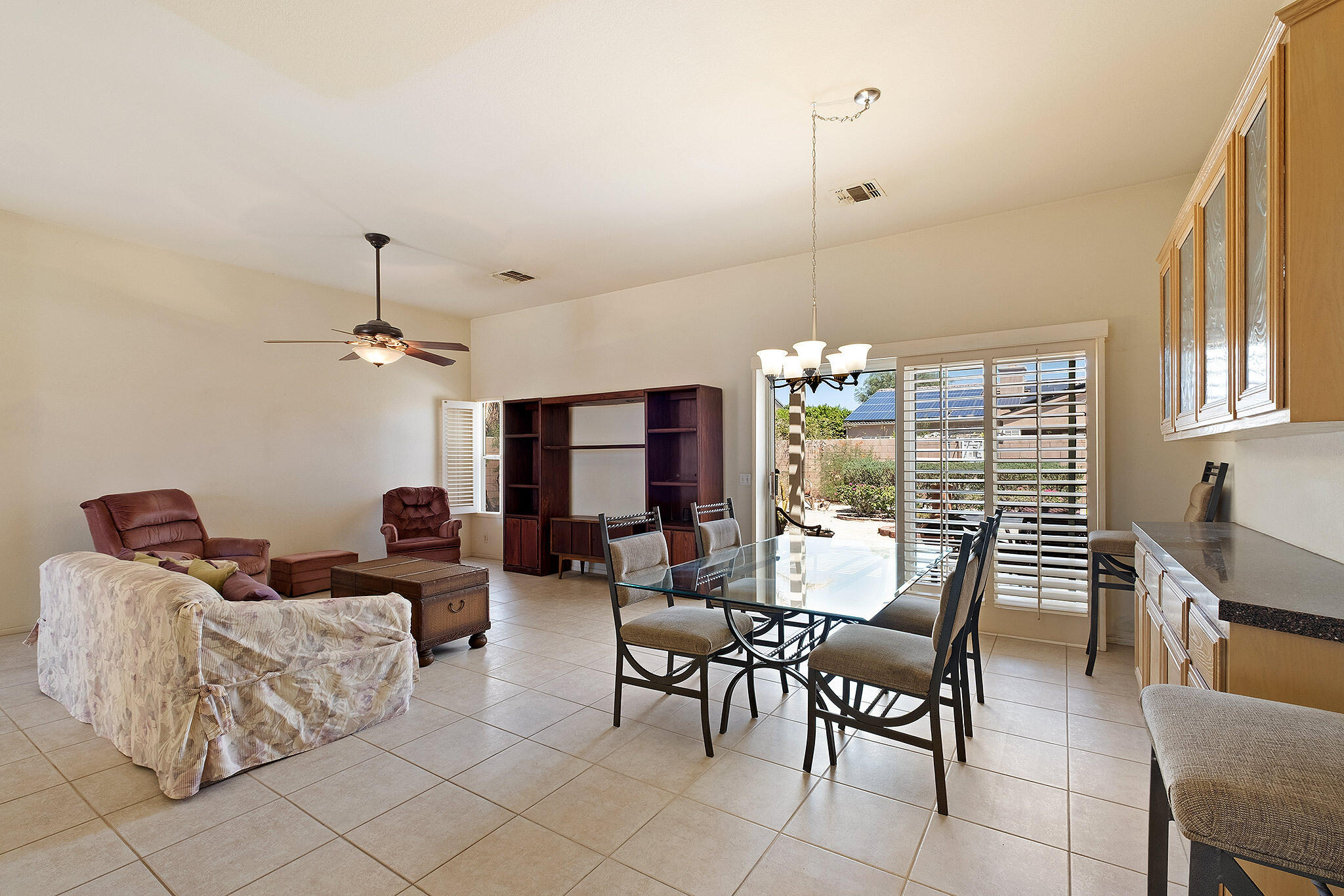 68338 Riviera Road Cathedral City, CA 92234 - Photo 12 of 29 a dining room with furniture and wooden floor
