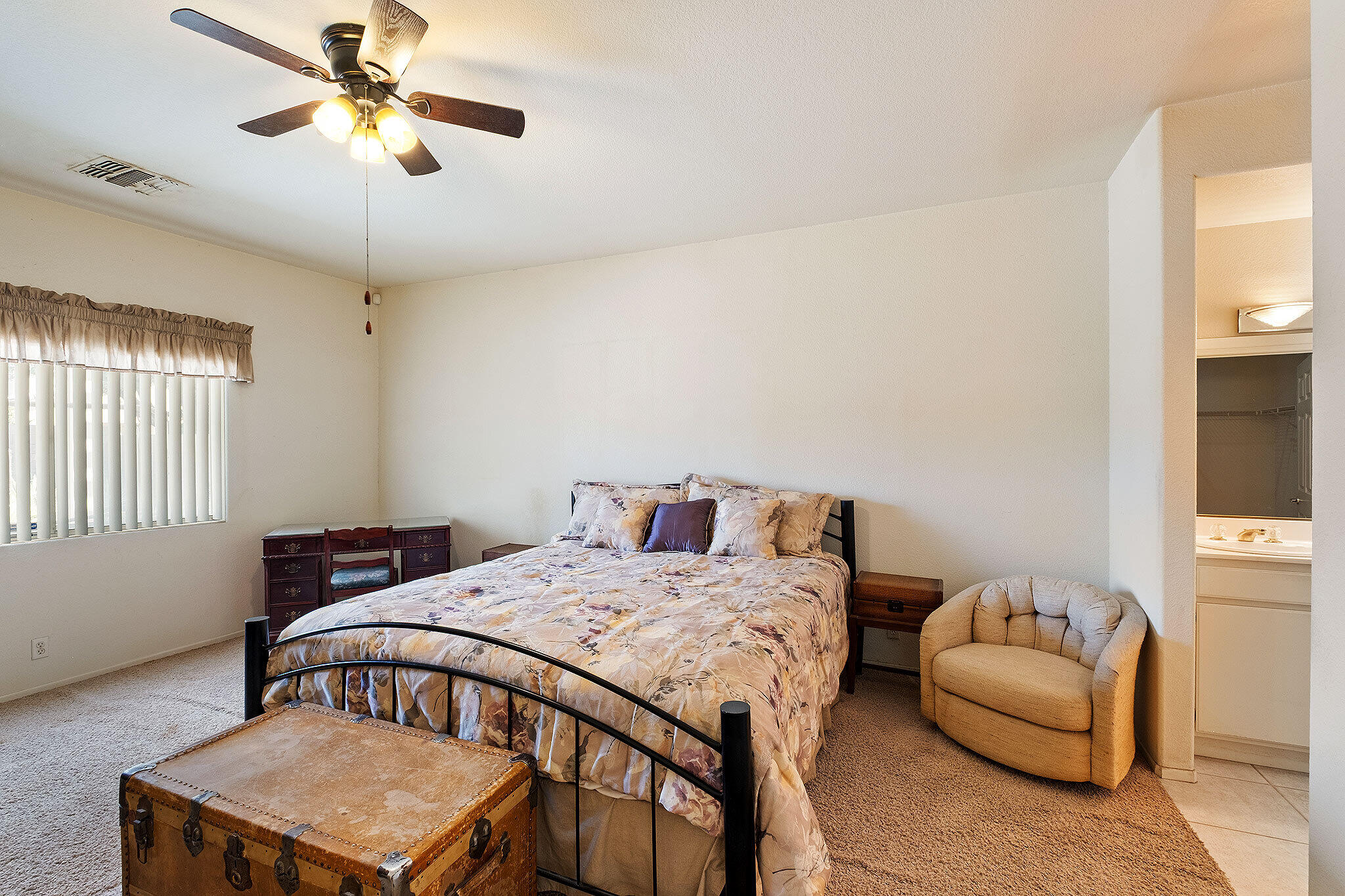 68338 Riviera Road Cathedral City, CA 92234 - Photo 20 of 29 a bedroom with a bed and a couch
