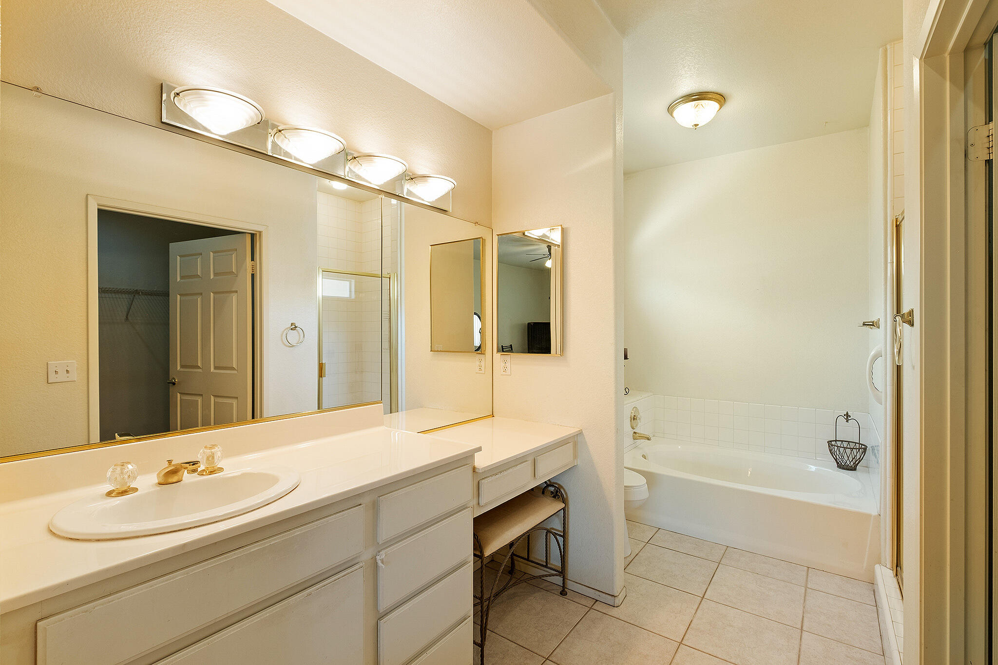 68338 Riviera Road Cathedral City, CA 92234 - Photo 21 of 29 a bathroom with a tub sink double vanity and a mirror