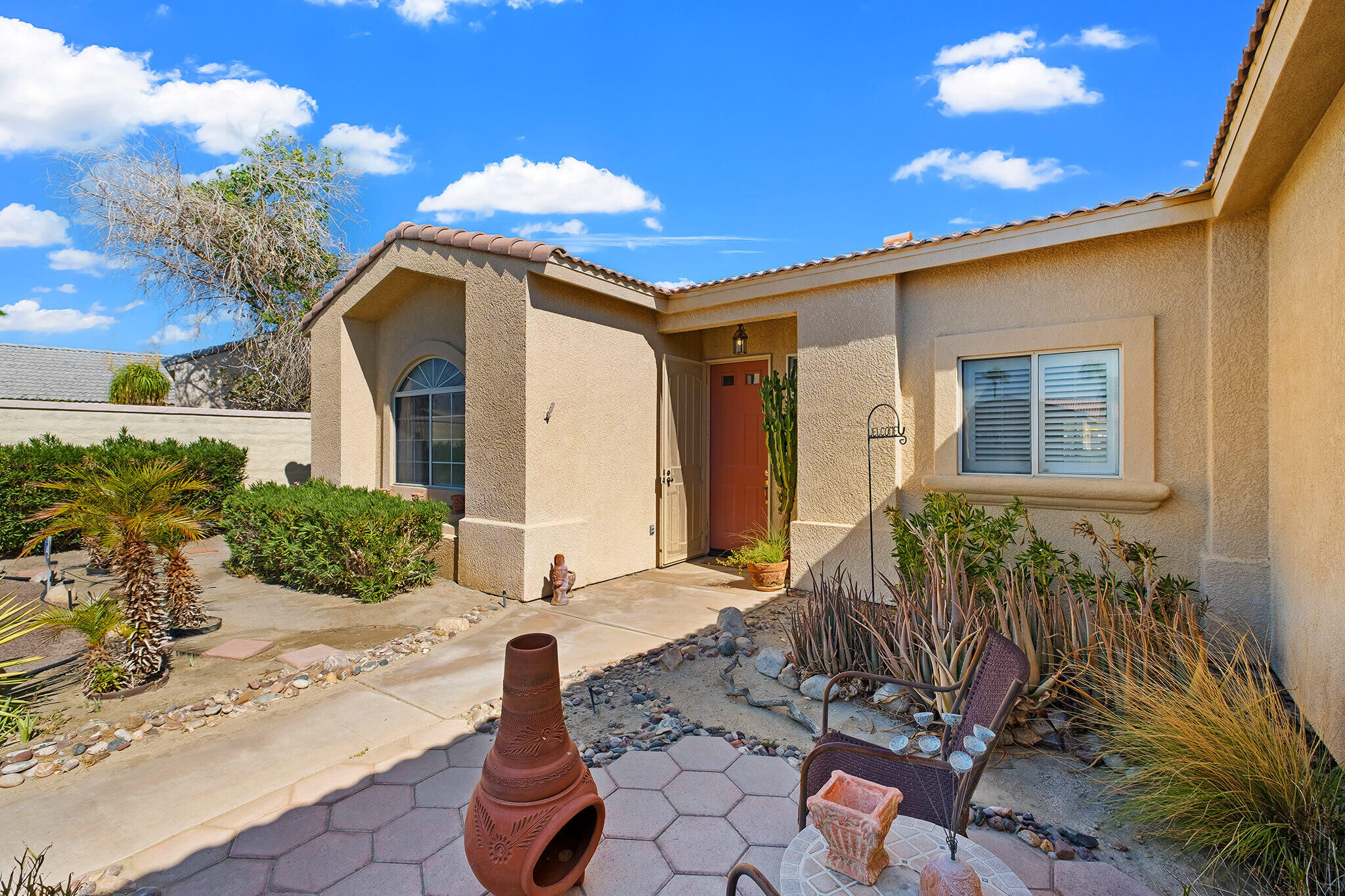 68338 Riviera Road Cathedral City, CA 92234 - Photo 4 of 29 a front view of a house with garden