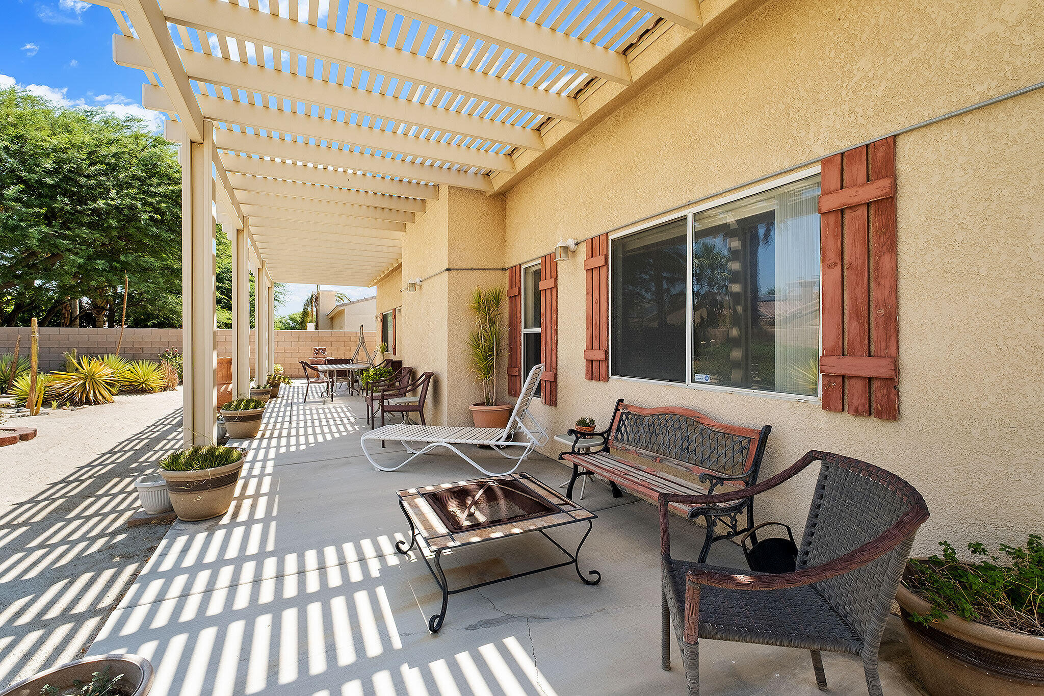 68338 Riviera Road Cathedral City, CA 92234 - Photo 9 of 29 a outdoor space with patio the couches and a dining table with garden view
