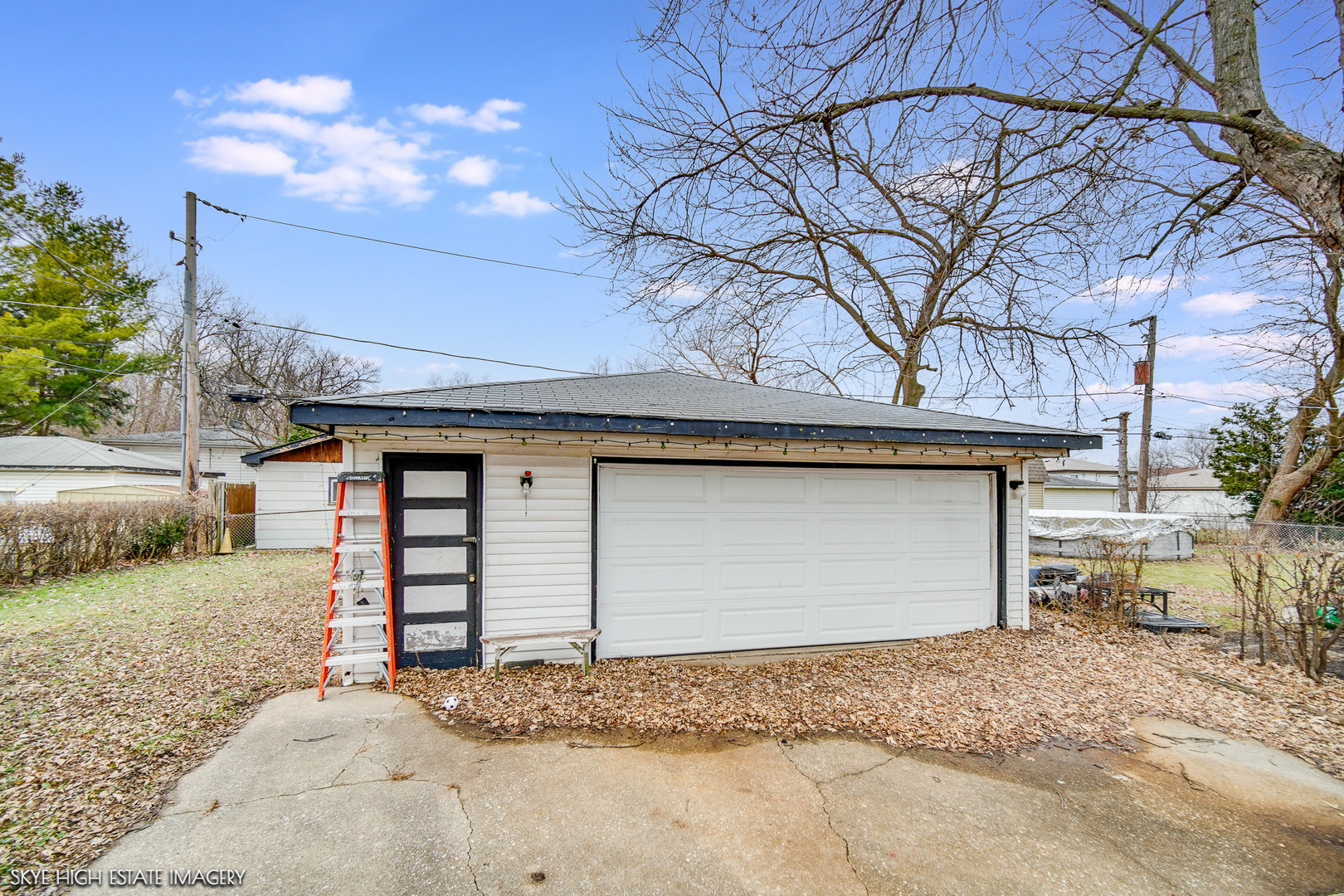 14850 Homan Avenue Midlothian, IL 60445 - Photo 13 of 13 a front view of a house with a yard and garage